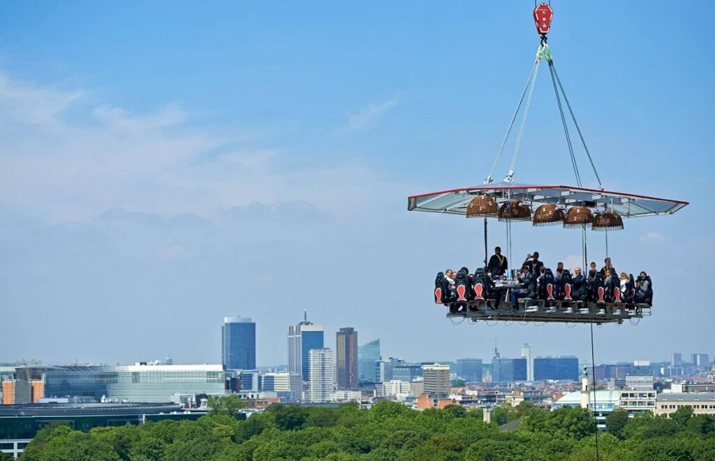 Dinner in the Sky dining table suspended above the city